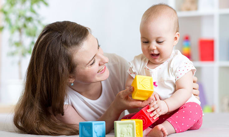 baby playing with blocks