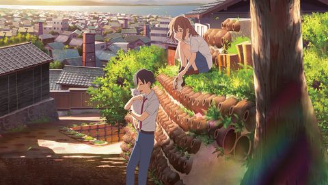 miyo and hinode talk while on a wall in a japanese village in a scene from a whisker away the movie is a good housekeeping pick for best kids movies on netflix