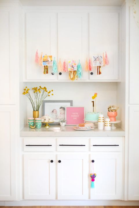 A first birthday party with a sweet and simple theme has a neutral color scheme with just a few pops of color a first birthday party with a sweet and simple theme has a neutral color scheme with just a few pops of color
