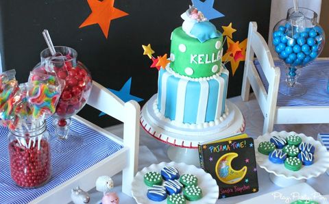 A pajama party themed first birthday party includes the pajama time board book by sandra boynton and night-themed food and decorations a pajama party themed first birthday party includes the pajama time board book by sandra boynton and night themed food and decorations