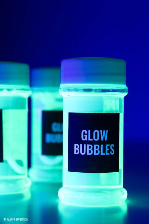a set of bubble bottles glow under a blacklight the project is a good housekeeping pick for best activities for kids