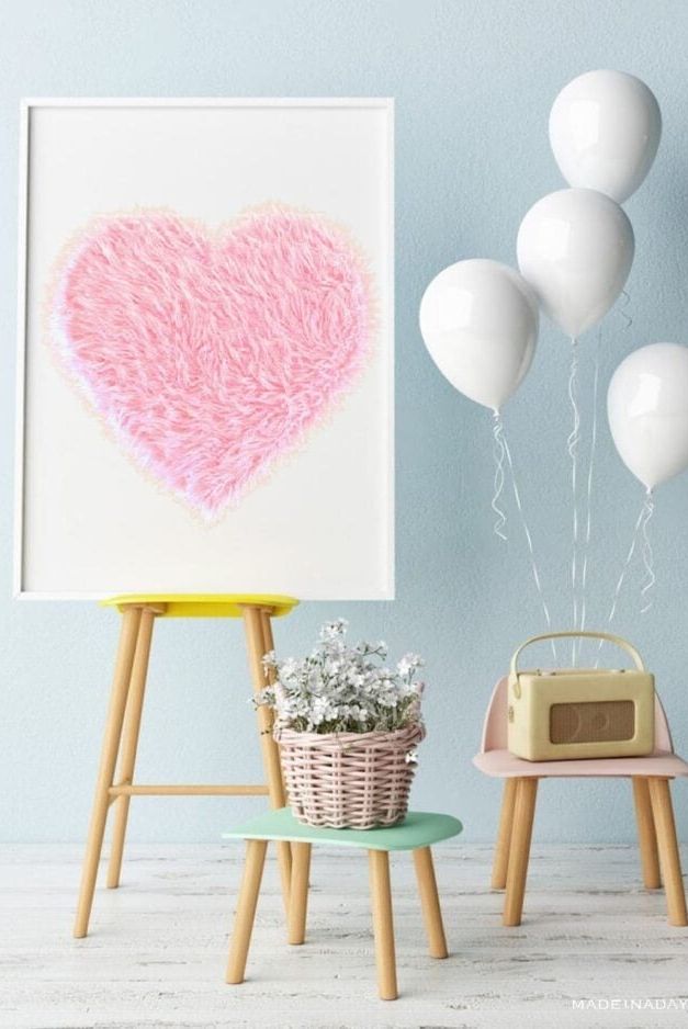 a fur heart on a display easel with other party decorations